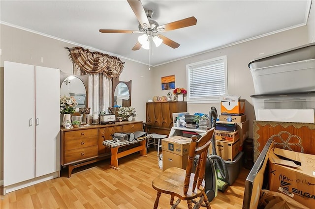 interior space featuring ceiling fan, light hardwood / wood-style flooring, and ornamental molding