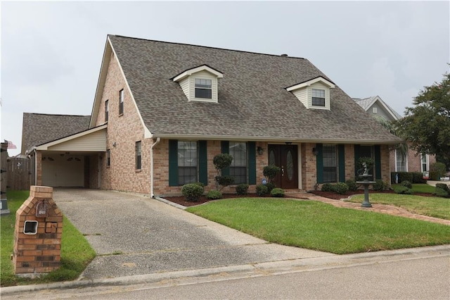 cape cod home featuring a carport and a front lawn