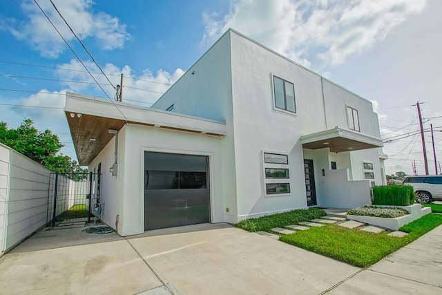 4317 Anthony St, Metairie, LA 70001 - view of front of house with stucco siding, a gate, and fence