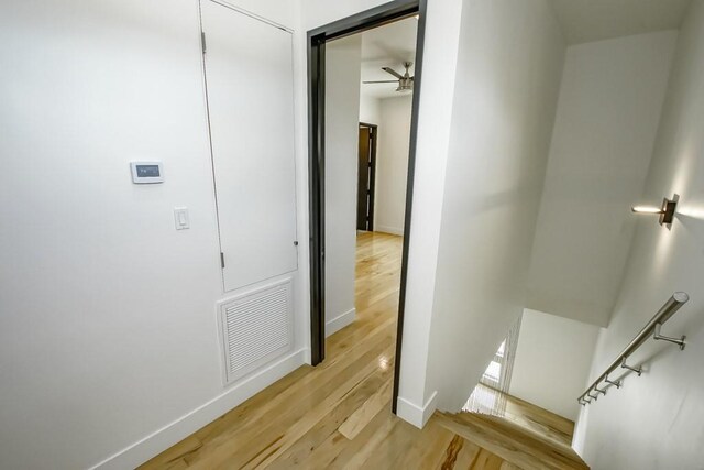 4317 Anthony St, Metairie, LA 70001 - hall featuring an upstairs landing, light wood-style flooring, and baseboards