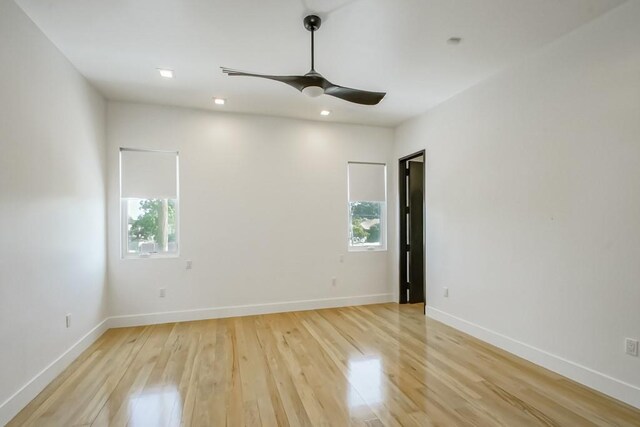 4317 Anthony St, Metairie, LA 70001 - empty room with light wood-style floors, healthy amount of natural light, a ceiling fan, and baseboards