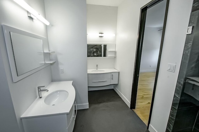 4317 Anthony St, Metairie, LA 70001 - full bath with two vanities and baseboards
