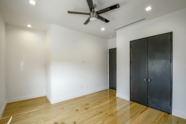 4317 Anthony St, Metairie, LA 70001 - unfurnished bedroom featuring light wood-style flooring, baseboards, recessed lighting, a closet, and ceiling fan