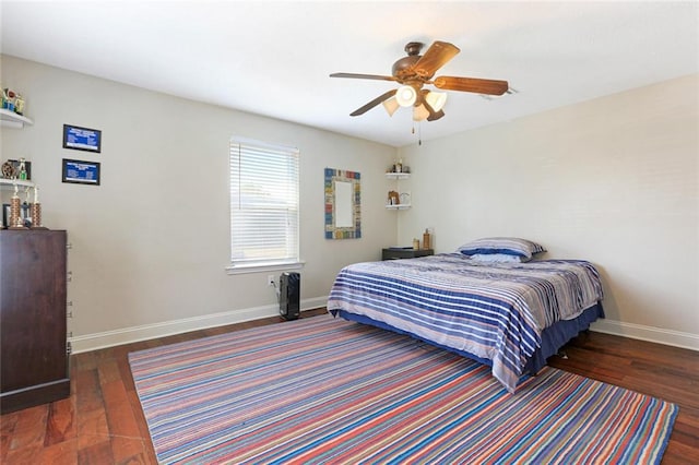 bedroom with ceiling fan and dark hardwood / wood-style floors