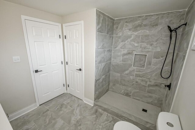 full bathroom with toilet, vanity, and tiled shower / bath