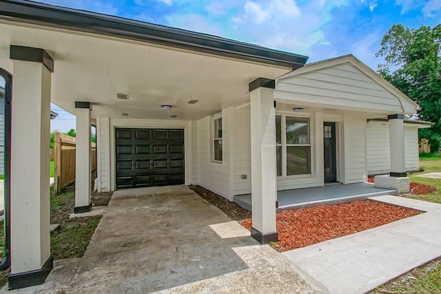 view of property exterior with a porch and a garage