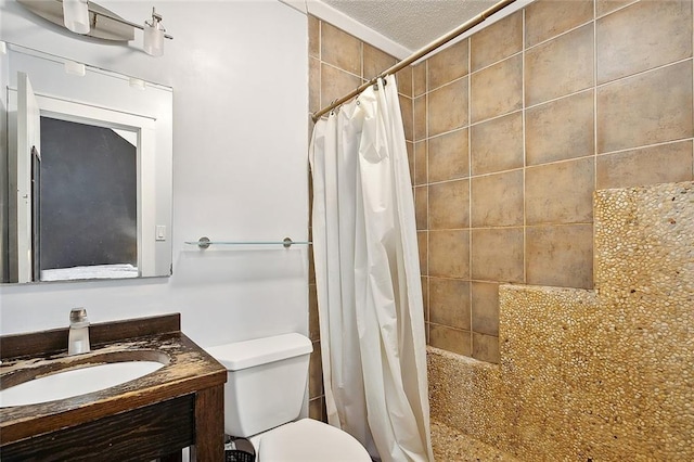 bathroom featuring toilet, a textured ceiling, vanity, and a shower with shower curtain