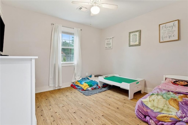 bedroom featuring ceiling fan and light wood-type flooring