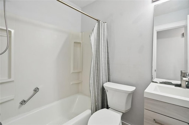 full bathroom with toilet, vanity, and shower / tub combo