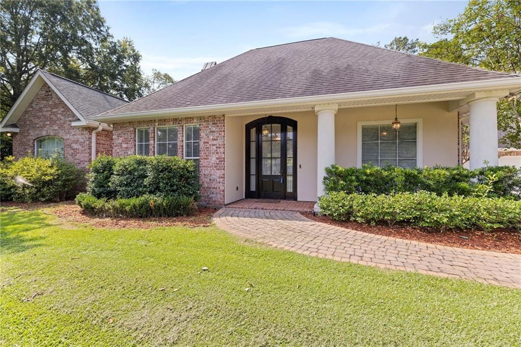 view of front of house with a front lawn and a porch