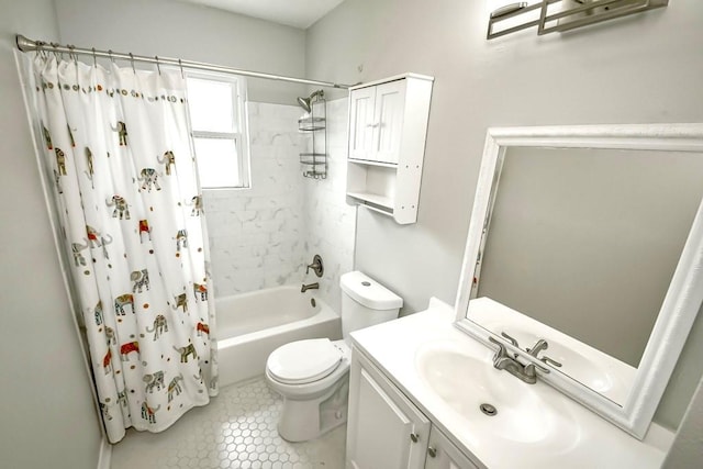 full bathroom with shower / tub combo, tile patterned floors, toilet, and vanity