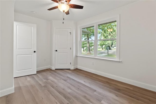 unfurnished bedroom with light hardwood / wood-style floors and ceiling fan