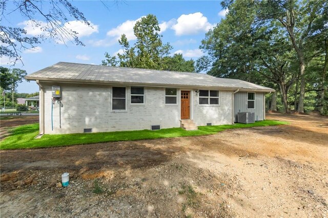 ranch-style home featuring cooling unit