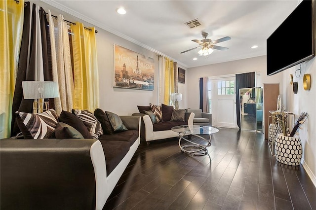 living room with ceiling fan, dark wood-type flooring, and ornamental molding