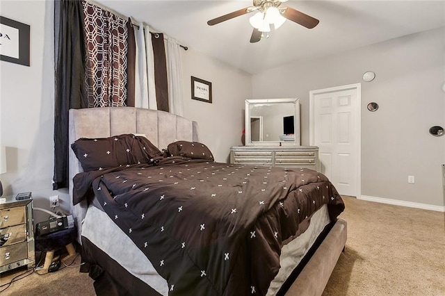 bedroom with ceiling fan and light carpet