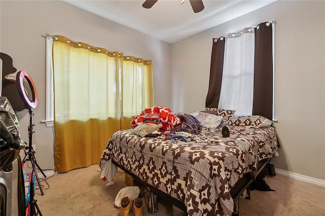 bedroom featuring carpet floors, ceiling fan, and lofted ceiling