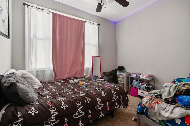 carpeted bedroom with ceiling fan