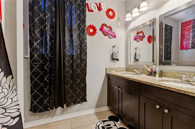 bathroom featuring dual bowl vanity and tile patterned flooring