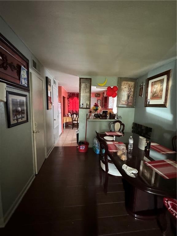 dining area with hardwood / wood-style floors