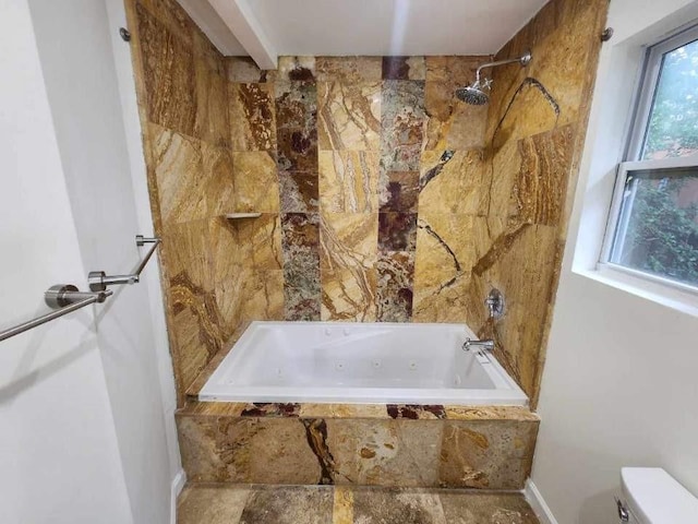 bathroom with toilet and tile patterned floors