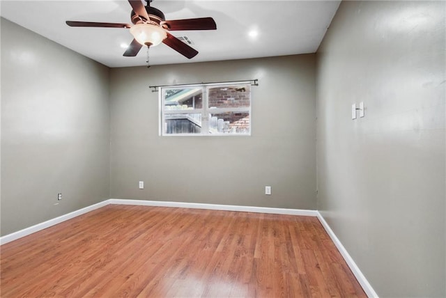 unfurnished room featuring ceiling fan and wood-type flooring