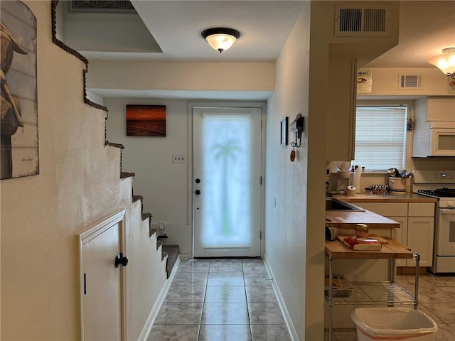 entrance foyer featuring light tile patterned floors