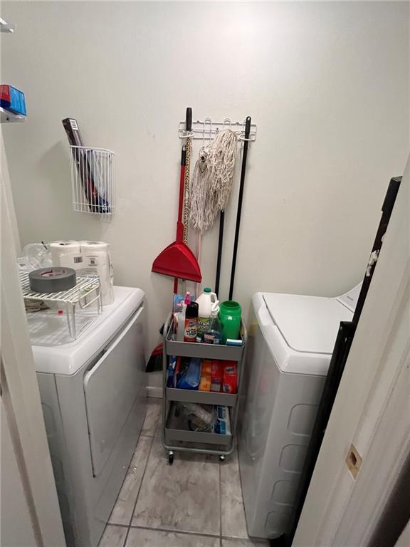 clothes washing area featuring washer and clothes dryer