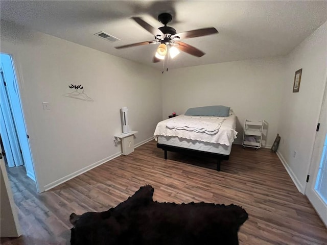 bedroom with hardwood / wood-style flooring and ceiling fan