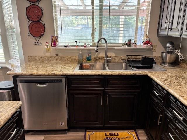 kitchen with dishwasher, a healthy amount of sunlight, and sink