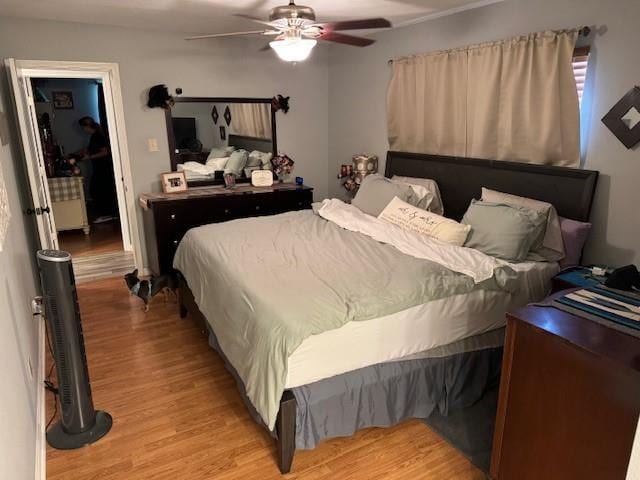 bedroom featuring ceiling fan and light wood-type flooring