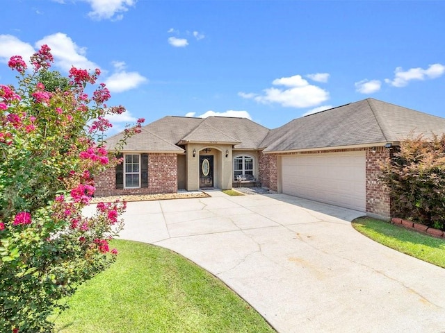 view of front facade with a garage and a front yard