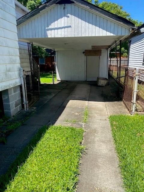 exterior space with a carport