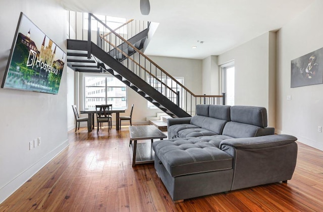 living room with plenty of natural light and hardwood / wood-style floors