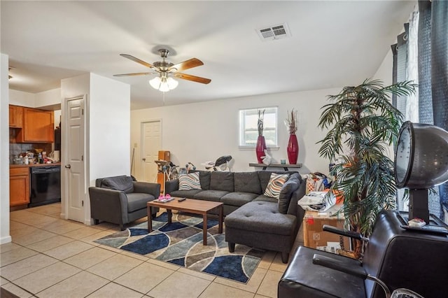 living room with ceiling fan and light tile patterned floors