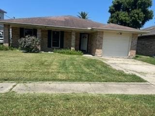 ranch-style house with a garage and a front yard