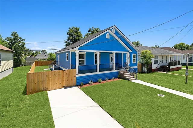 bungalow-style home featuring a porch and a front yard