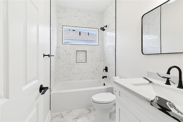 full bathroom with tile patterned floors, toilet, vanity, and tiled shower / bath