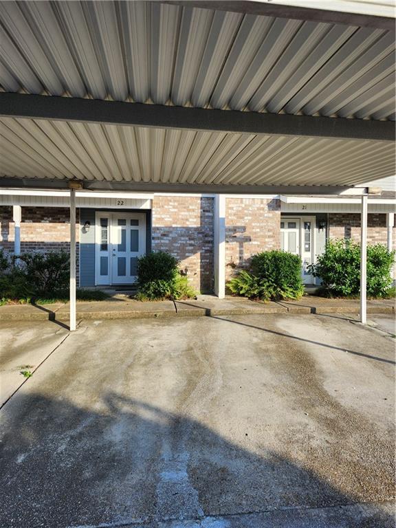 exterior space with a carport and french doors