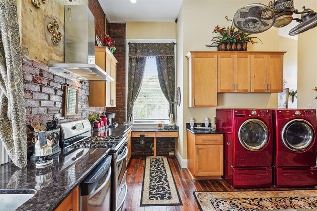 laundry area featuring dark wood-type flooring and separate washer and dryer