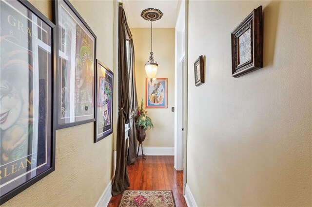 corridor featuring hardwood / wood-style flooring