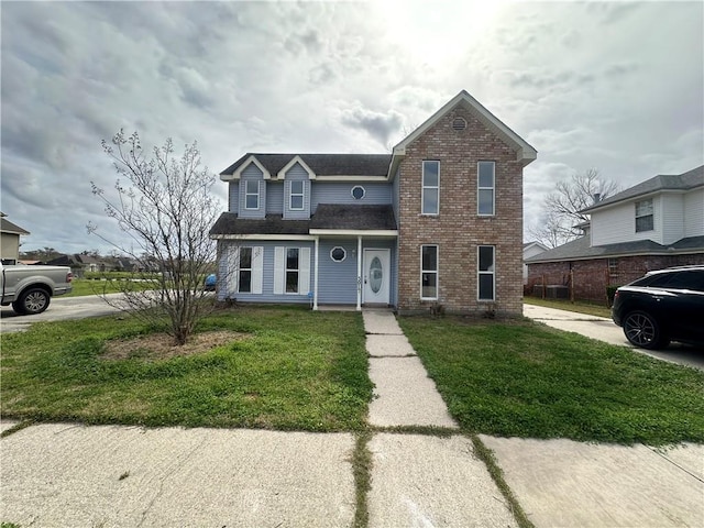 front facade with a front lawn