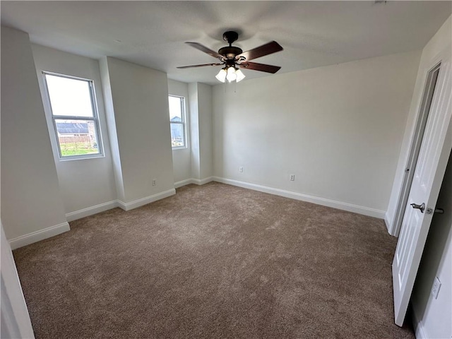 carpeted empty room with ceiling fan