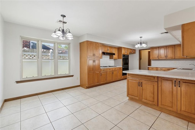 kitchen with hanging light fixtures, black appliances, an inviting chandelier, sink, and decorative backsplash