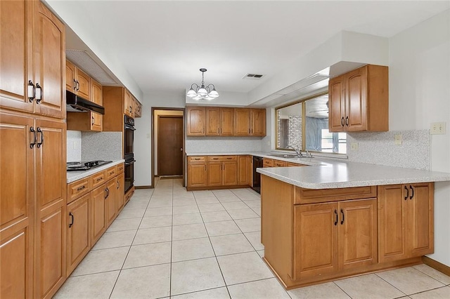 kitchen featuring a chandelier, sink, decorative light fixtures, black appliances, and kitchen peninsula