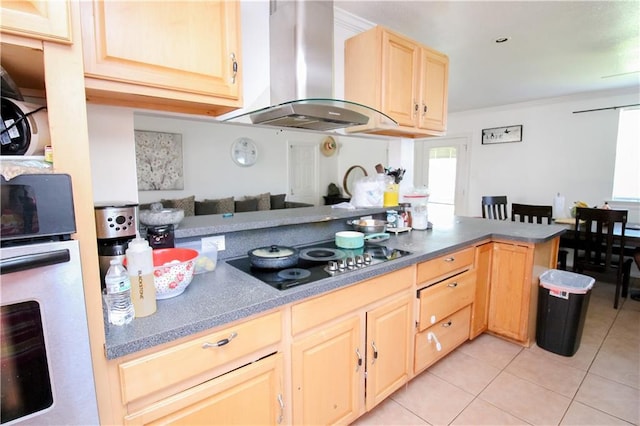 kitchen with black electric stovetop, light brown cabinetry, wall chimney range hood, oven, and kitchen peninsula