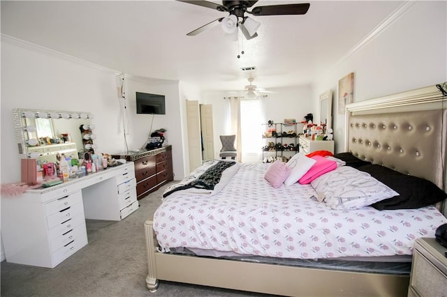 bedroom with carpet flooring, ceiling fan, and crown molding