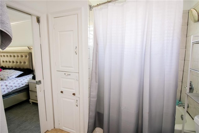 bathroom with shower / bathtub combination with curtain