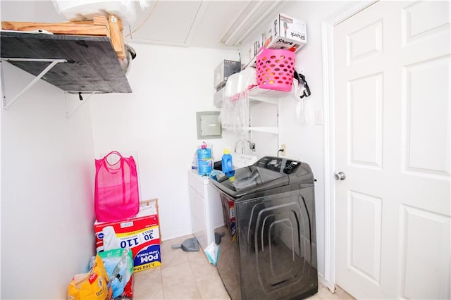 washroom with light tile patterned flooring and separate washer and dryer