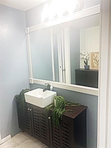 bathroom featuring vanity and tile patterned flooring