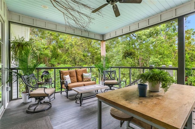 sunroom / solarium with ceiling fan